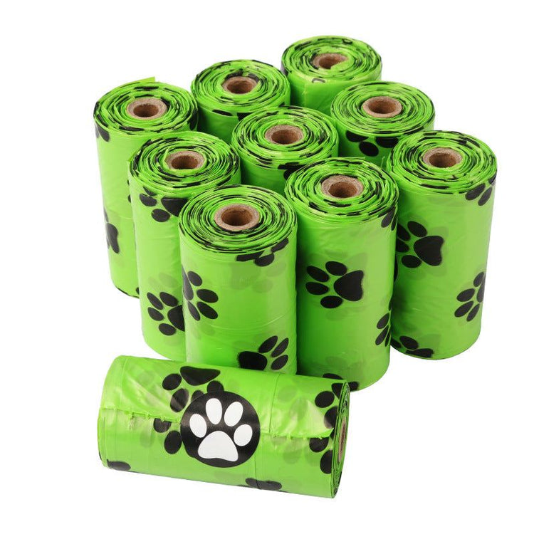 Roll of green biodegradable dog poop bags for pet waste disposal
