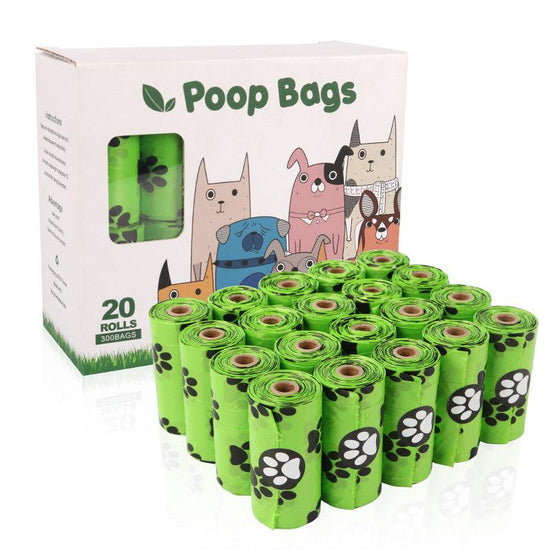 Green continuous roll dog poop bags with dispenser for pet waste cleanup