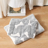 Self-warming cat bed mat with reversible fleece and non-slip backing for cozy pet comfort